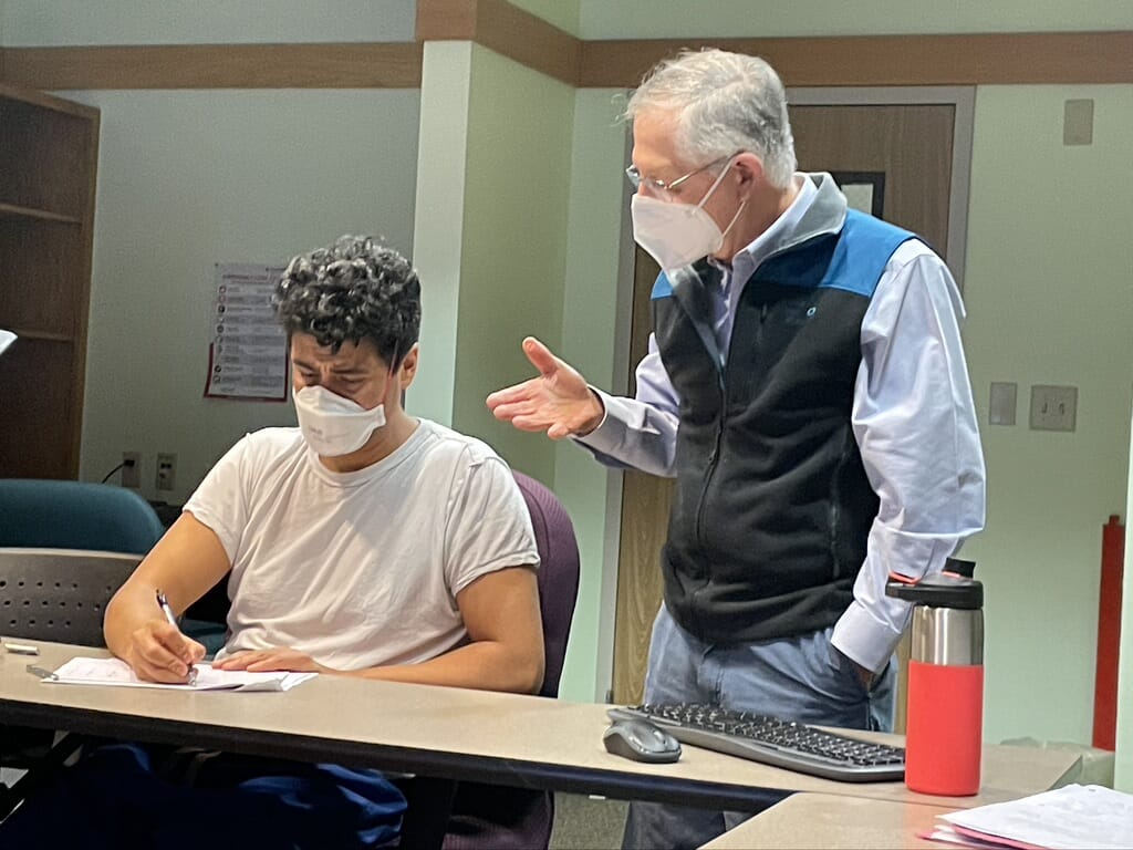 Community Teacher of the Year George Pantely, Cardiologist instructing 3rd year resident Fernando Polanco during one of his EKG Series sessions